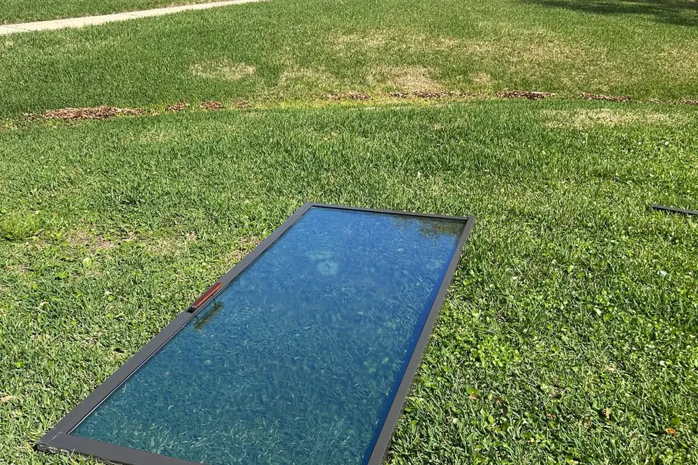 Sliding glass door panel removed and laid flat for glass replacement