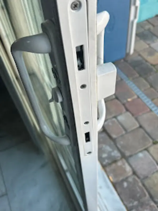 A sliding door mortise lock installed on the door edge