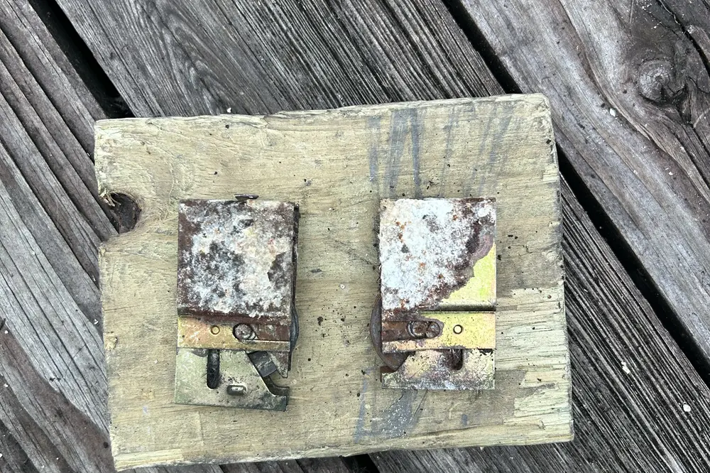 Rusted sliding door roller brackets at the end of their life