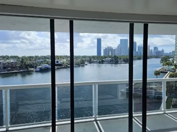 Multi-panel commercial sliding glass doors on a waterfront balcony