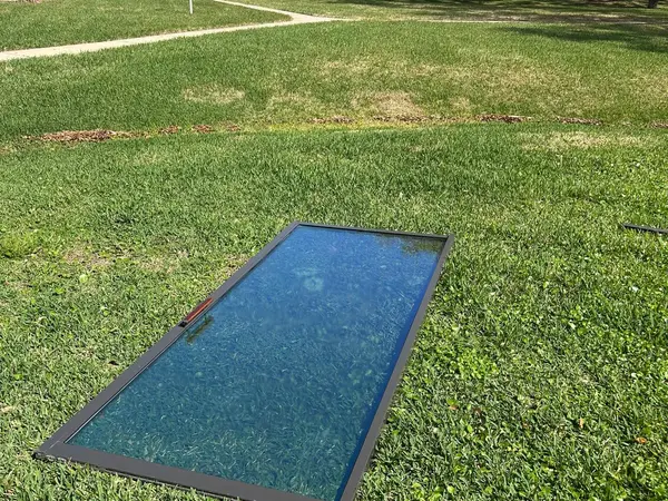 Sliding door glass panel removed and laid flat for glass replacement